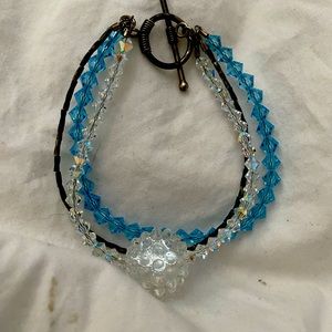 Hand blown glass snowball with blue crystals and silver strand bracelet
